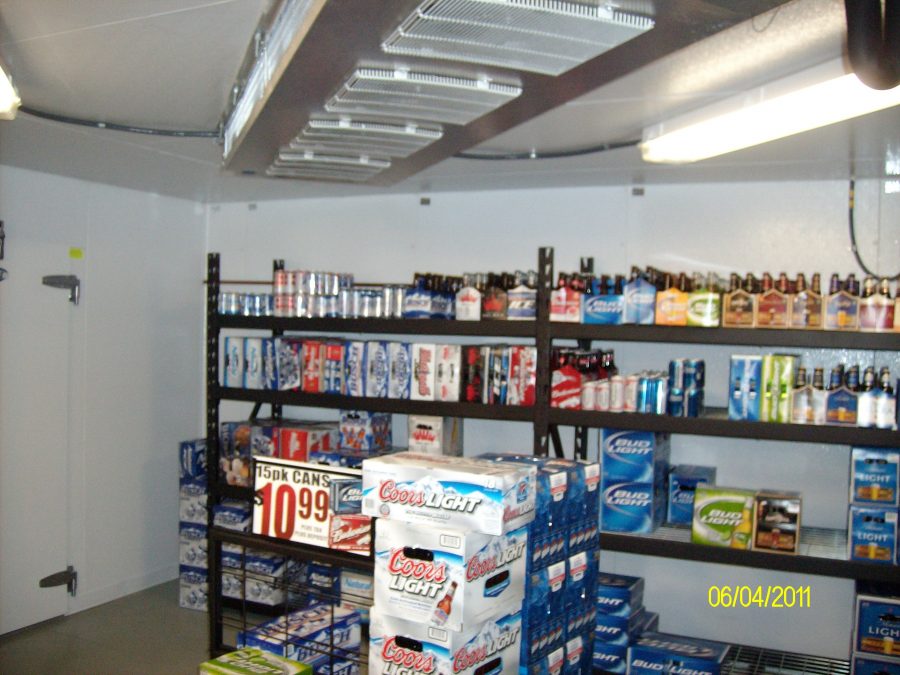 Interior of liquor store showing walk in beer cooler